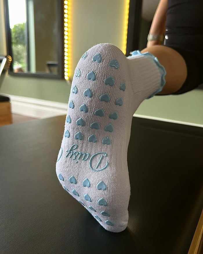 Bluebell Pilates grip socks, the silicone heart grip sole in use