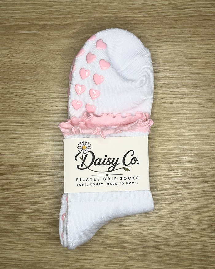 Pink Blossom Pilates grip socks in their Daisy Co. packaging