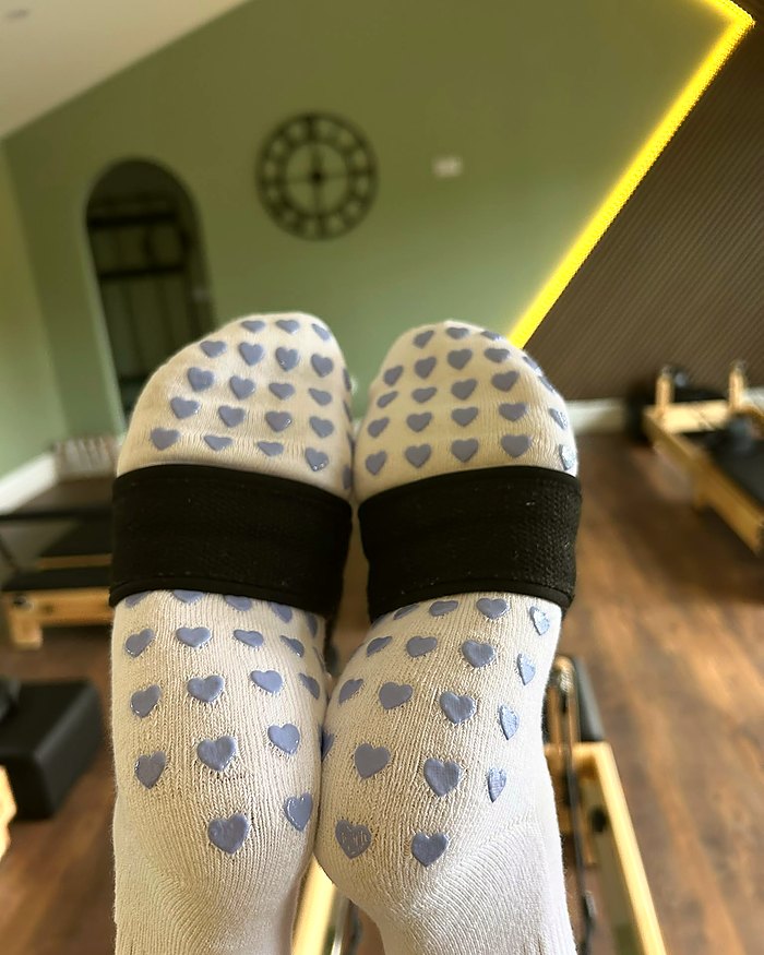 Lilac Dream Pilates grip socks during a reformer class