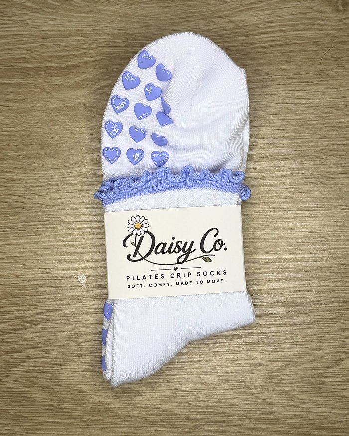 Lilac Dream Pilates grip socks in their Daisy Co. packaging