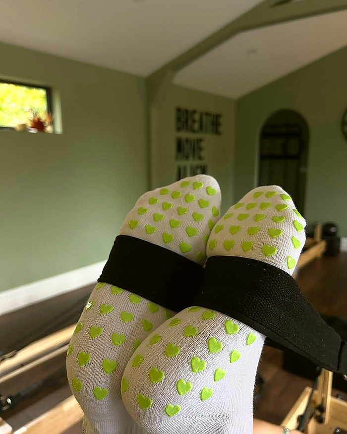 Fresh Meadow Pilates grip socks during a reformer class