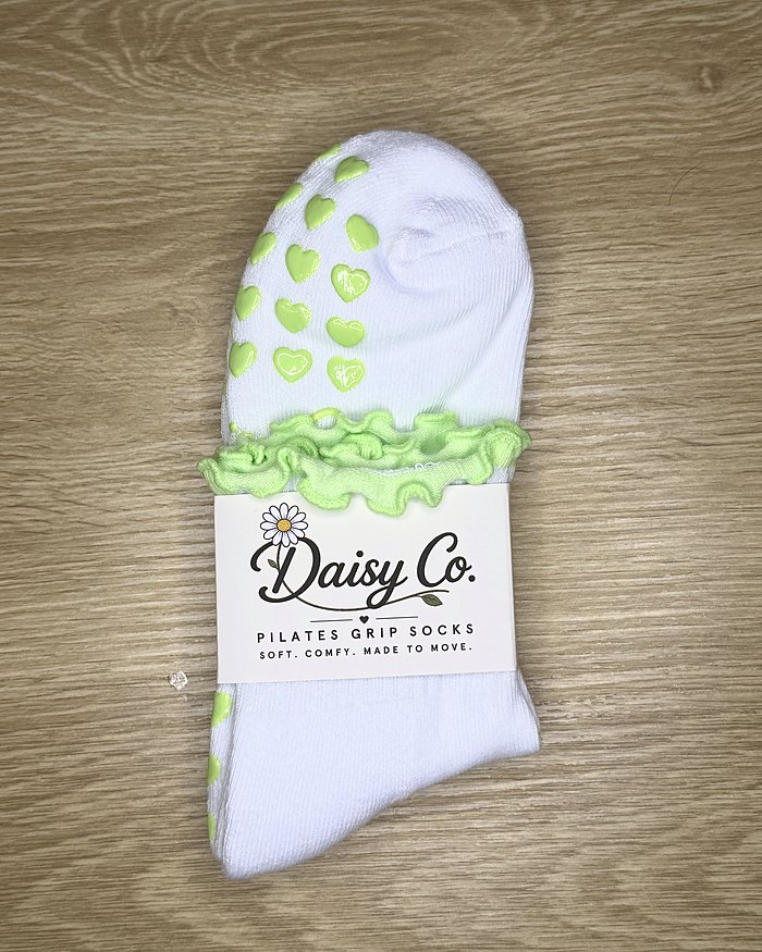 Fresh Meadow Pilates grip socks in their Daisy Co. packaging