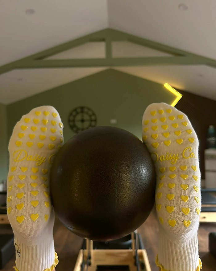 Limoncello Pilates grip socks, the silicone heart grip sole in use