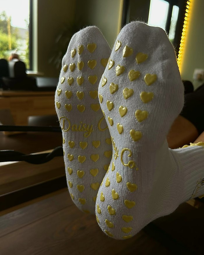 Limoncello Pilates grip socks during a reformer class