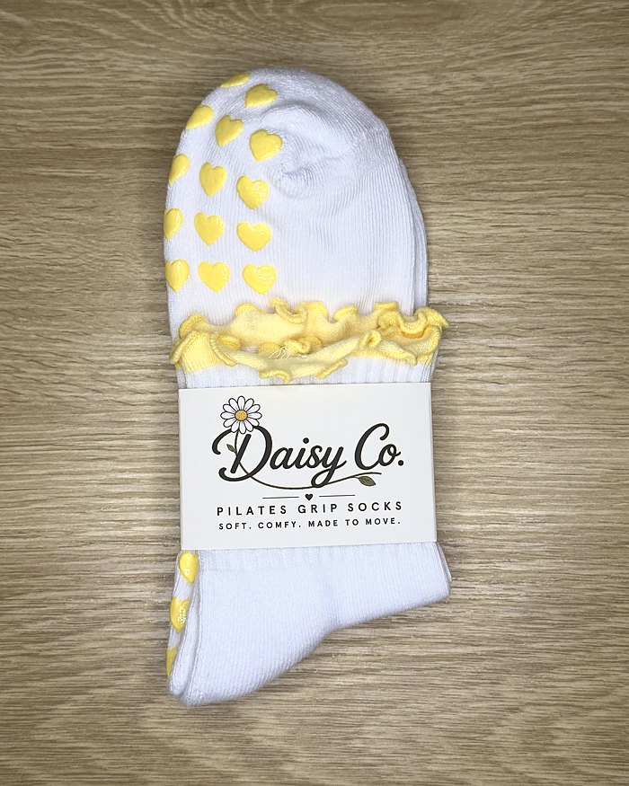 Limoncello Pilates grip socks in their Daisy Co. packaging