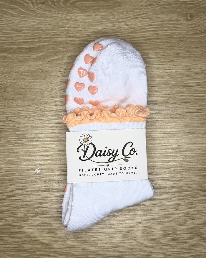 Coral Kiss Pilates grip socks in their Daisy Co. packaging