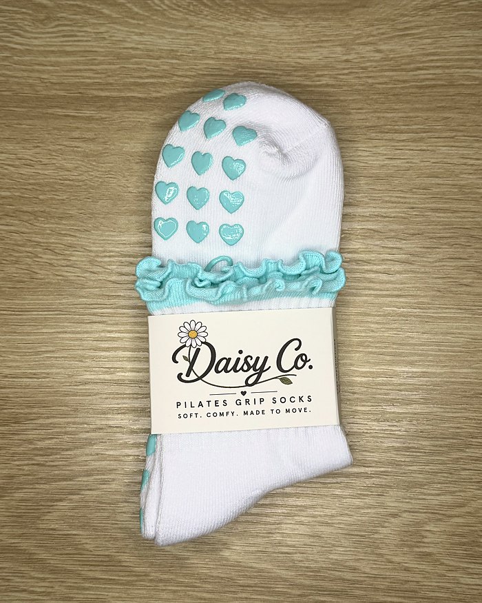 Sea Mist Pilates grip socks in their Daisy Co. packaging