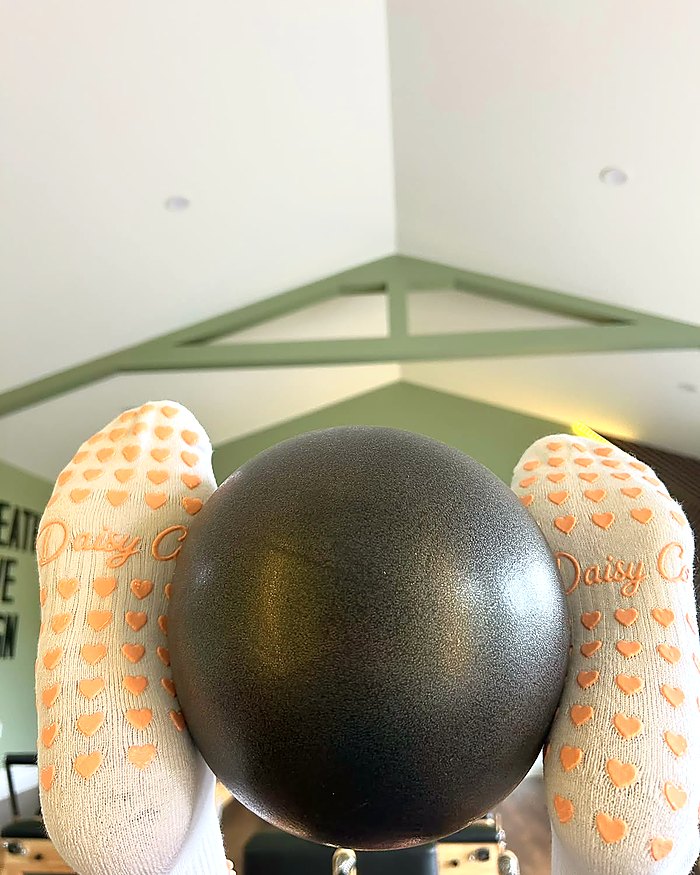 Bare Muse Pilates grip socks, the silicone heart grip sole in use
