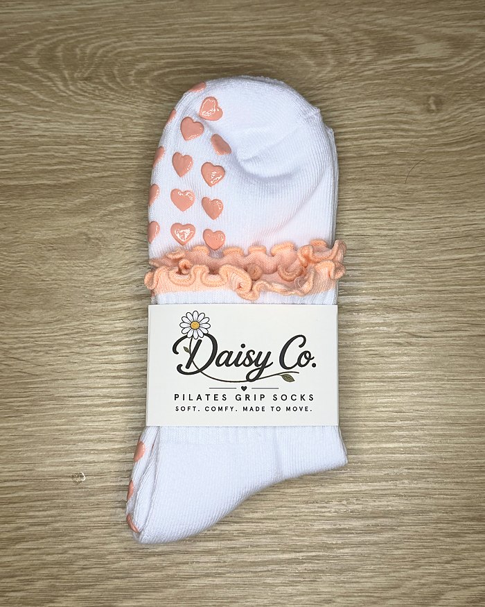 Bare Muse Pilates grip socks in their Daisy Co. packaging