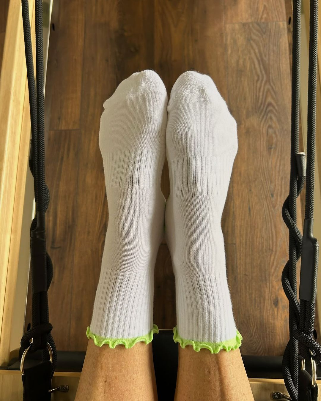 Fresh Meadow grip socks on the reformer footbar